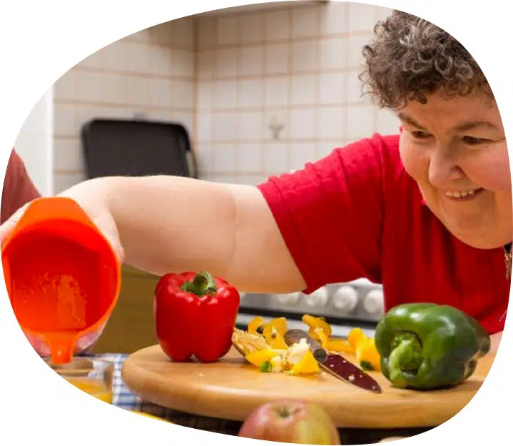 Woman Cooking — Supported Independent Living in Bundaberg, QLD